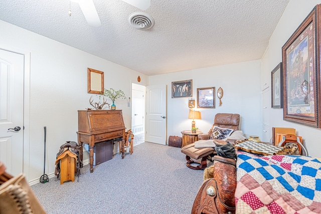 3615 W Wadley Ave, Midland, TX 79707 - bedroom with carpet, a textured ceiling, and a ceiling fan