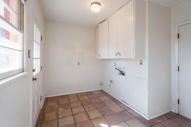 clothes washing area with hookup for a washing machine and cabinets