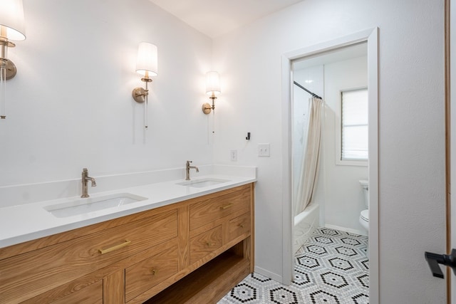 full bathroom featuring toilet, vanity, tile patterned flooring, and shower / tub combo with curtain