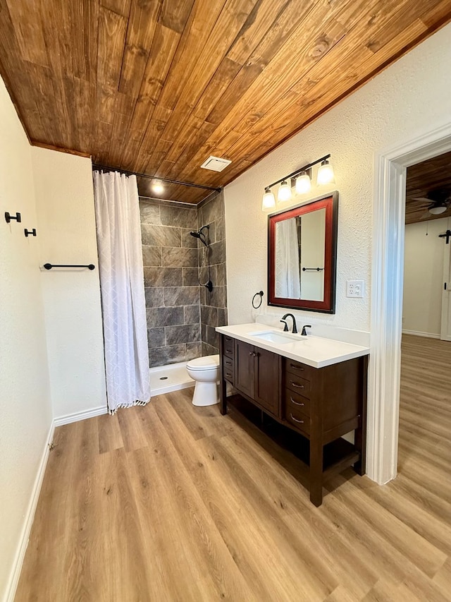 bathroom with visible vents, wood finished floors, a stall shower, and wooden ceiling