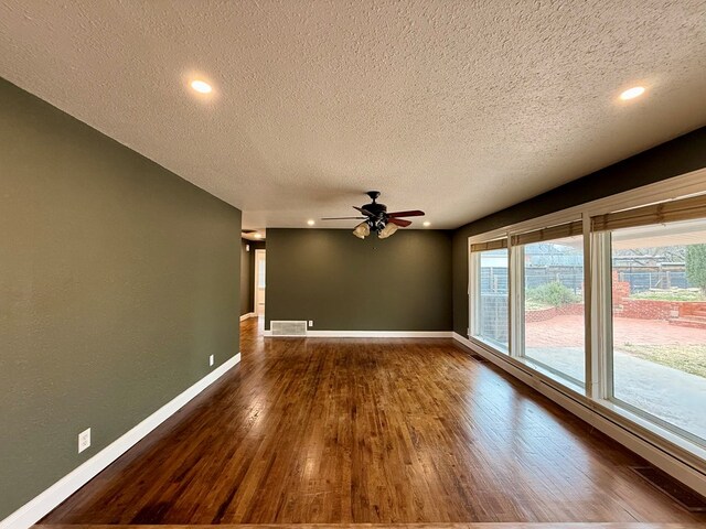 unfurnished living room with ceiling fan, a textured ceiling, and light wood-type flooring