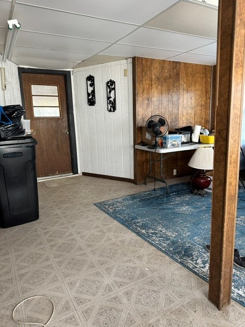 interior space featuring wood walls