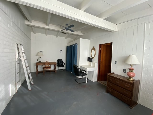 interior space featuring ceiling fan