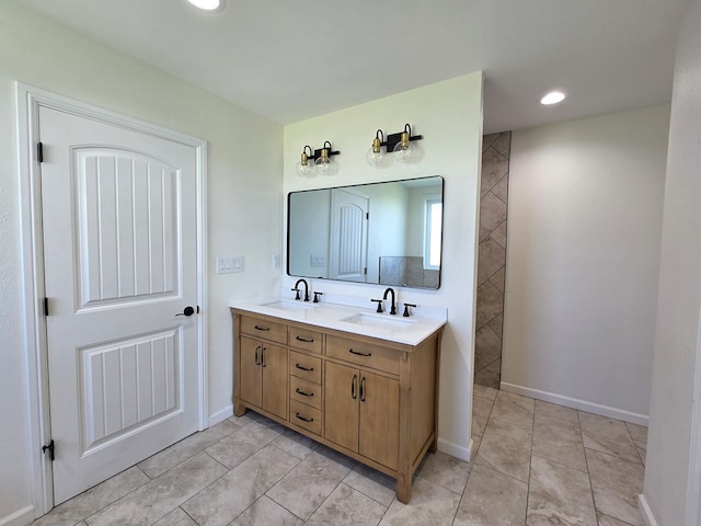 bathroom with vanity and tile patterned flooring