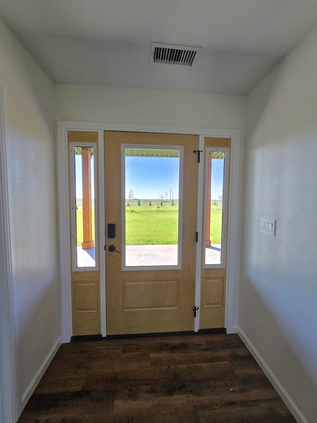 doorway with dark wood-type flooring