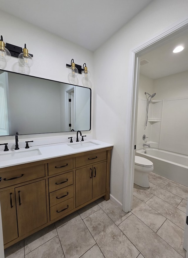 full bathroom with tub / shower combination, toilet, tile patterned floors, and vanity