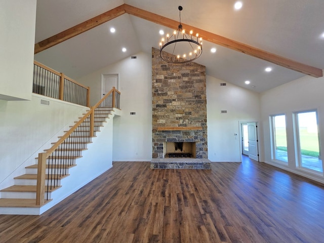 unfurnished living room with a notable chandelier, a fireplace, high vaulted ceiling, beam ceiling, and dark hardwood / wood-style flooring