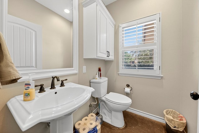 5712 Carmel Ct, Midland, TX 79707 - half bath with a sink and finished concrete flooring