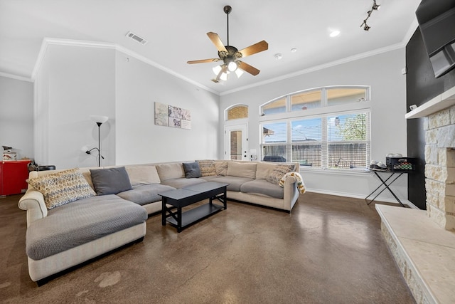 5712 Carmel Ct, Midland, TX 79707 - living room featuring concrete floors, a ceiling fan, crown molding, and a fireplace