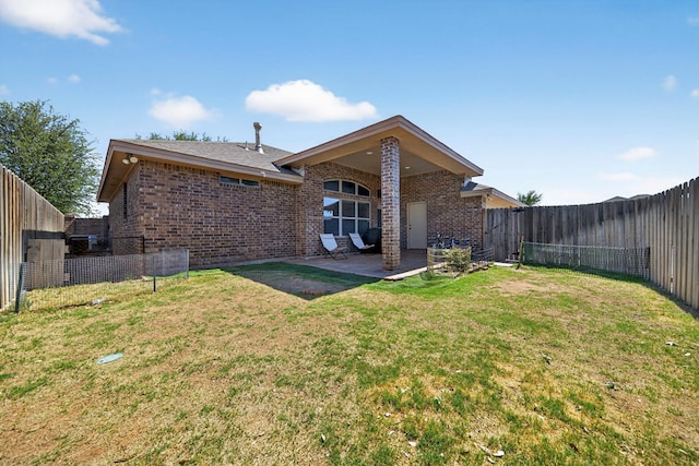 5712 Carmel Ct, Midland, TX 79707 - back of property with brick siding, a fenced backyard, and a patio