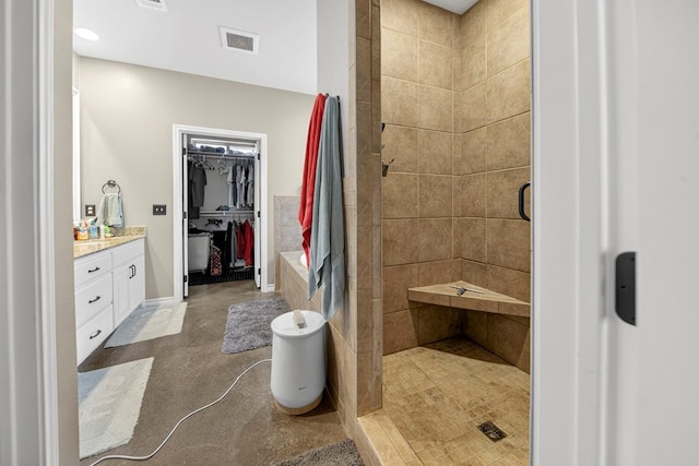 5712 Carmel Ct, Midland, TX 79707 - bathroom with a stall shower, vanity, and a spacious closet