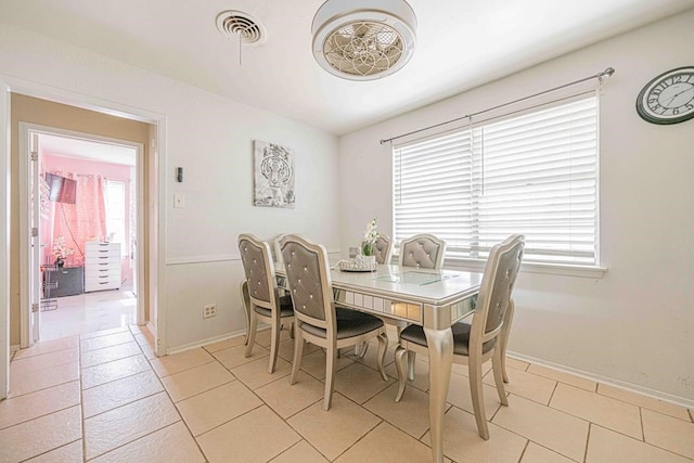 tiled dining space with plenty of natural light