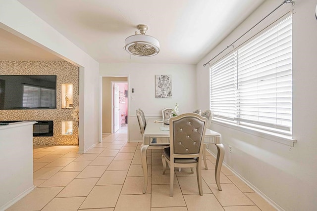 dining space featuring light tile patterned flooring