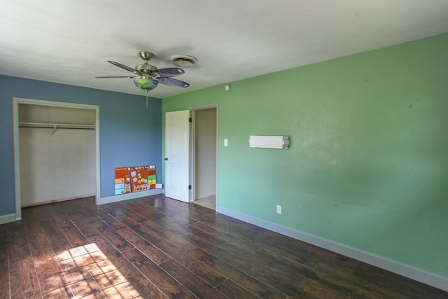 207 W Robinson Rd, Big Spring, TX 79720 - unfurnished bedroom with wood finished floors, a closet, and a ceiling fan