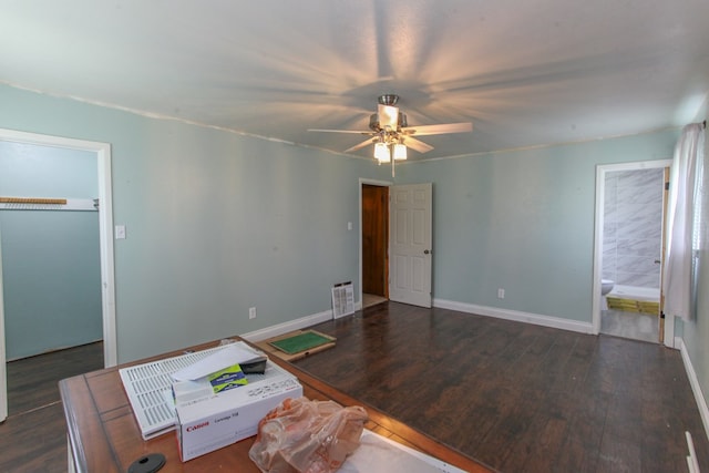 207 W Robinson Rd, Big Spring, TX 79720 - unfurnished bedroom featuring wood finished floors and a ceiling fan