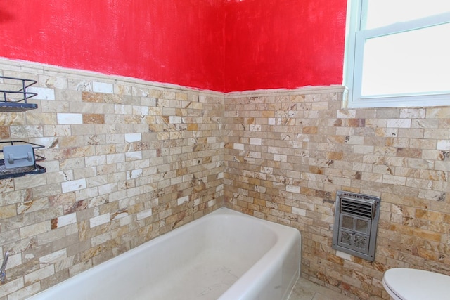 207 W Robinson Rd, Big Spring, TX 79720 - bathroom featuring heating unit and a tub to relax in