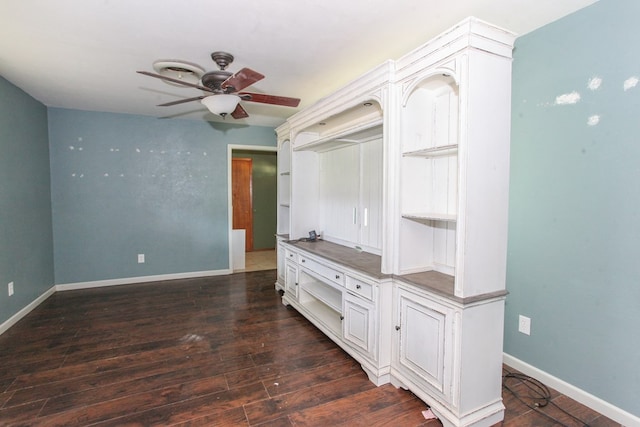207 W Robinson Rd, Big Spring, TX 79720 - unfurnished living room with ceiling fan and dark wood-type flooring