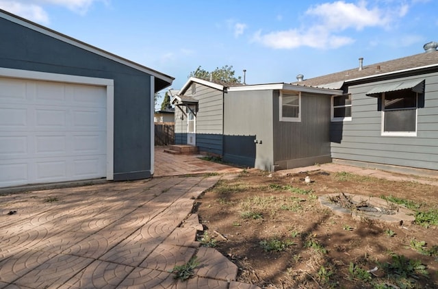 view of property exterior with a garage