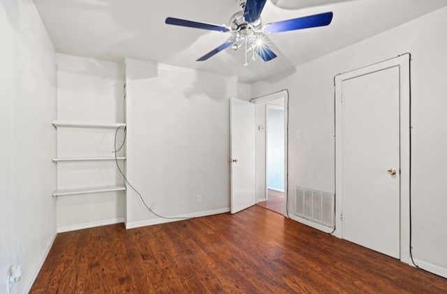 unfurnished bedroom featuring dark hardwood / wood-style floors and ceiling fan