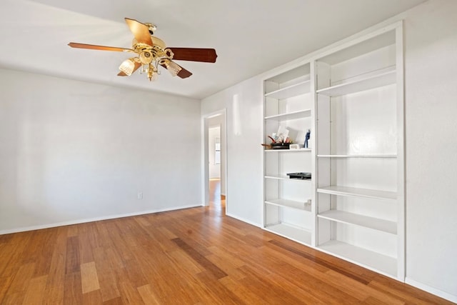 spare room with ceiling fan and hardwood / wood-style floors