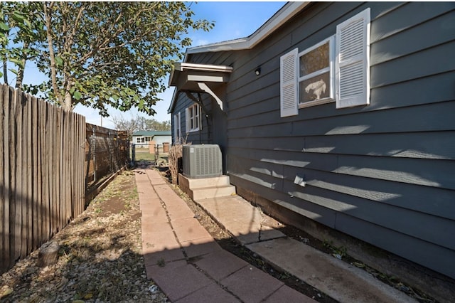 view of side of property featuring central AC