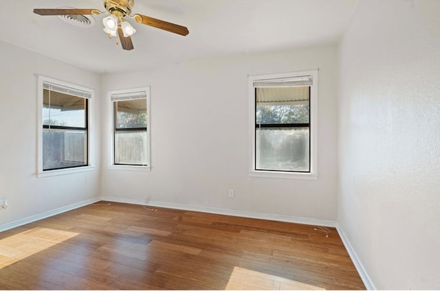 spare room featuring ceiling fan and light hardwood / wood-style floors