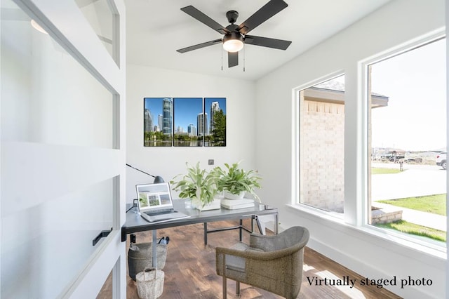 office space with a ceiling fan, baseboards, and wood finished floors