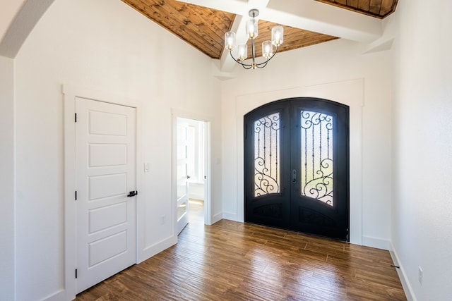 entryway featuring french doors, wooden ceiling, a chandelier, and dark wood-type flooring