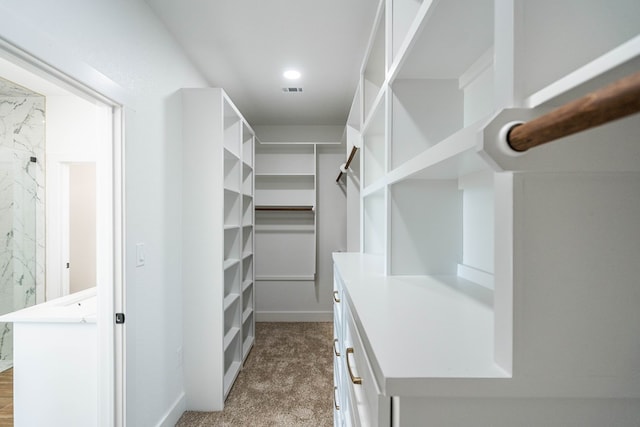 walk in closet featuring carpet and visible vents