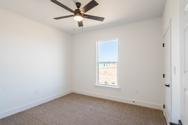 unfurnished room featuring carpet floors, a ceiling fan, and baseboards