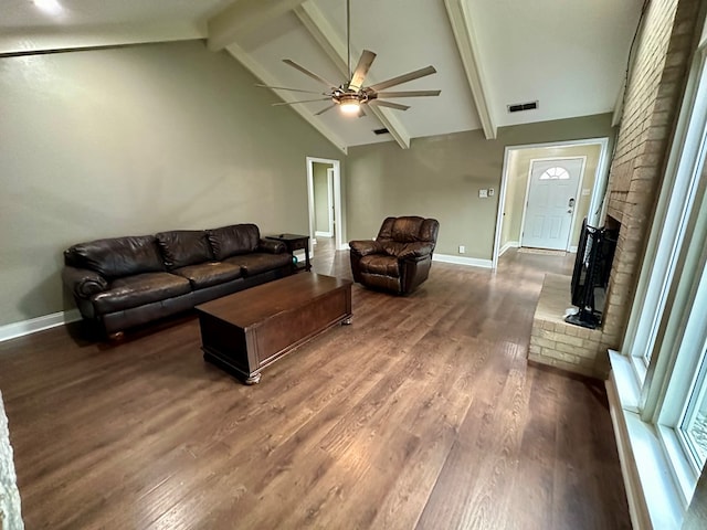 living room with ceiling fan, dark hardwood / wood-style floors, beam ceiling, and high vaulted ceiling