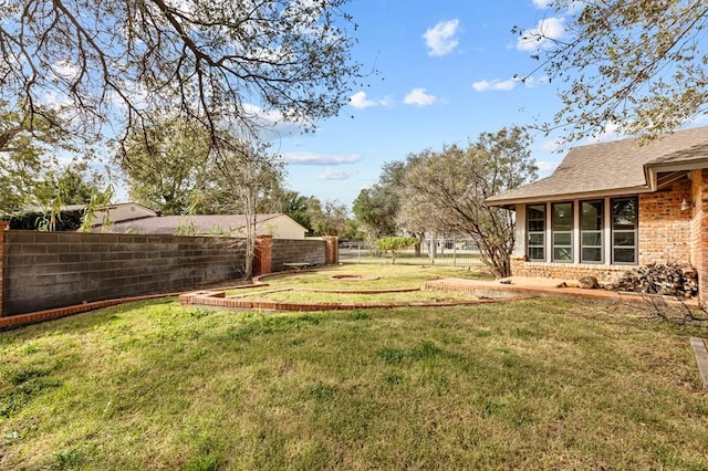 view of yard with fence