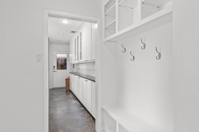 mudroom featuring concrete floors