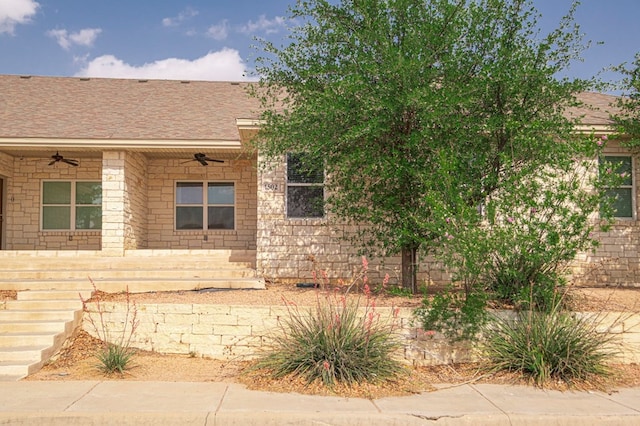 view of front of house featuring a porch, a shingled roof, and ceiling fan