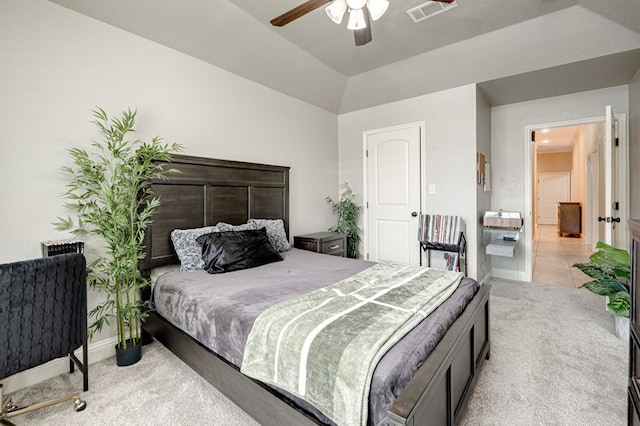 bedroom with visible vents, a ceiling fan, lofted ceiling, baseboards, and carpet flooring