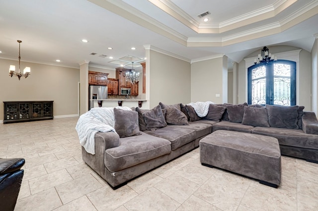 living area with an inviting chandelier, ornamental molding, recessed lighting, and visible vents