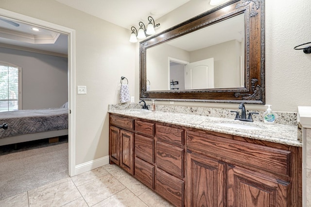 ensuite bathroom with a sink, crown molding, ensuite bath, and double vanity