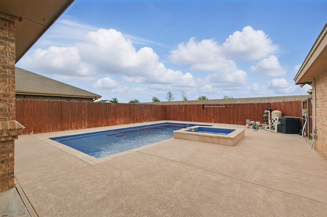 view of pool featuring a fenced backyard, a patio area, central air condition unit, and a pool with connected hot tub