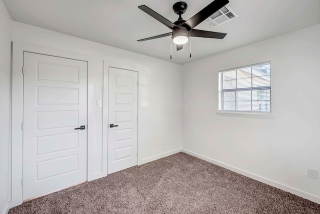 unfurnished bedroom with carpet floors and ceiling fan