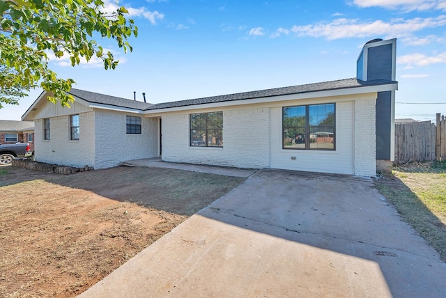 ranch-style home featuring a patio