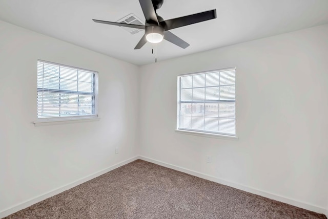 carpeted empty room featuring ceiling fan