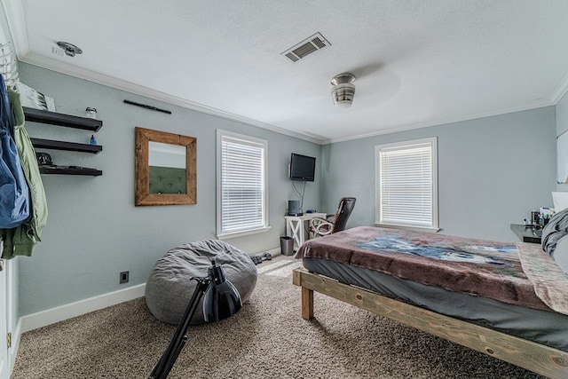 carpeted bedroom with ceiling fan, a textured ceiling, and ornamental molding