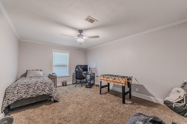 bedroom with ceiling fan, carpet floors, and ornamental molding