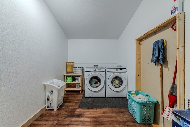 clothes washing area featuring separate washer and dryer and dark hardwood / wood-style floors