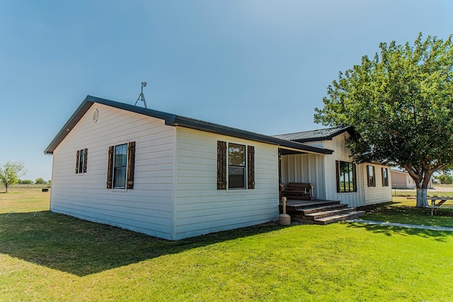 exterior space with a lawn