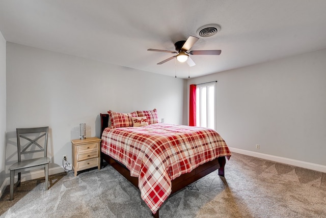 bedroom with baseboards, visible vents, ceiling fan, and carpet