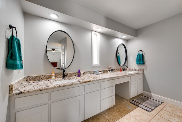 bathroom featuring double vanity, tile patterned floors, a ceiling fan, and a sink