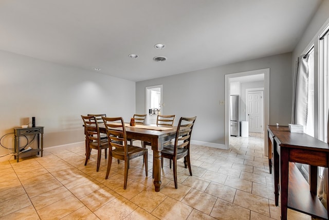 dining space featuring light tile patterned flooring, baseboards, visible vents, and recessed lighting