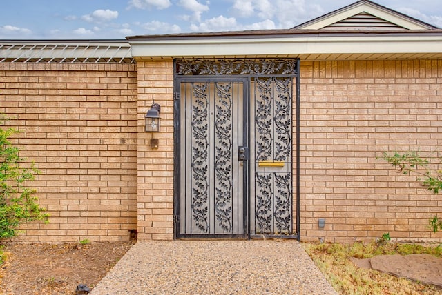 property entrance with brick siding
