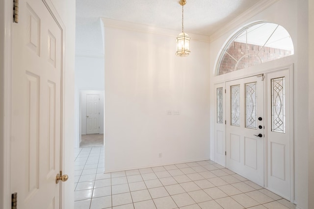 5500 Drexel, Midland, TX 79707 - foyer featuring light tile patterned floors, ornamental molding, and a chandelier